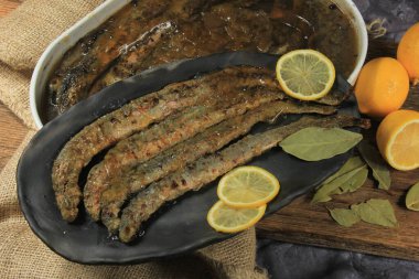 Fried whole lampreys on a plate, Fish delicacies, Latvian cuisine clipart