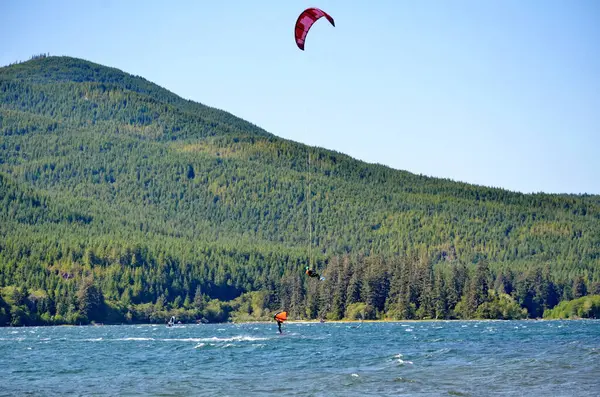 Stock image Kiteboarding at Nitinat Lake on Vancouver Island, BC, Canada. Nitinaht is one of the best kiteboarding locations in Canada because of its steady and consistent winds.