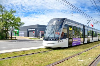 Toronto, Ontario, Canada, June 28, 2024: A Eglinton Crosstown LRT test train makes it's way along the transit line in Scarborough. There is no opening date yet for the line as of Sept. 2024. clipart