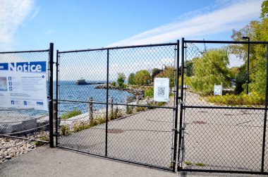 Toronto, Ontario, Canada, September 23, 2023: The security fence cutting off the East Island at Ontario Place from the west end. The OP west end as of Sept 2024 has no public access. clipart