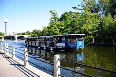 Ottawa, Canada. September 13, 2018: Tourist boat cruising on the Rideau Canal in early September. This cruise runs from the Ottawa River to Dow's Lake. clipart