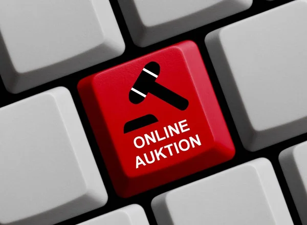 Online Auction in german language on red computer keyboad 3D illustration
