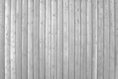 Yıpranmış tahtaları olan eski gri ahşap duvar.