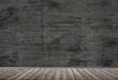 Ahşap zemin ve gri beton duvarlı boş bir çatı katı.