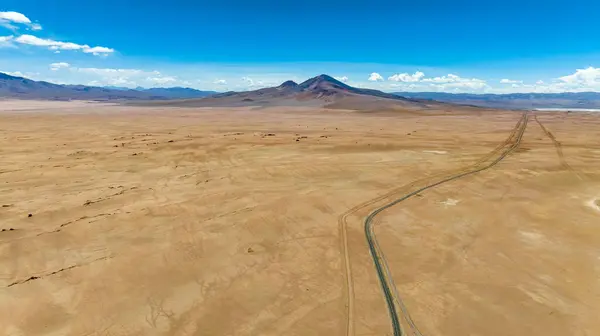 stock image Atacama Desert in Chile. Aerial view. Route 27, road during a car trip. Salar de Loyoques. South America