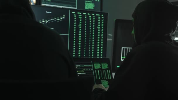 Two Hackers Coding Hack Company Servers Using Monitor Screens Green — Stock Video