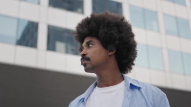 Portrait Of Positive Happy African American Man Standing In the City