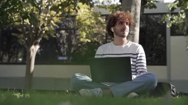 Male University Student Freelancer Using Laptop Sitting Grass Campus City — Vídeos de Stock