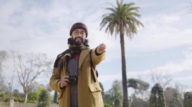 Young man taking photo portrait of friends in winter