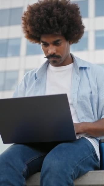 African American Freelancer Working Laptop Sitting Outdoors Vertical Video — Video