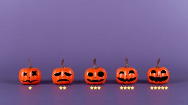 Pumpkin made from plastic with smile face emotico or with icon rating feedback scale on purple background. Halloween and decoration concept. Service rating, feedback, satisfaction concept