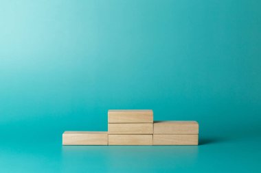 Wooden podium standing or podium platform to show producton blue background