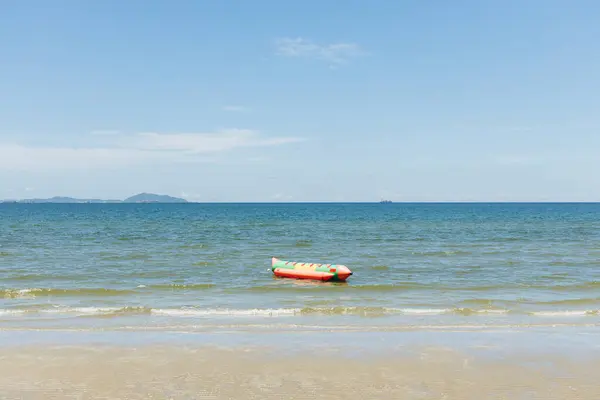 stock image Beach sea space area. Beautiful tropical beach and Inflatable boat with blue sky and white clouds in sunny day