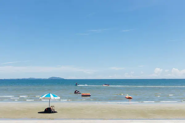 stock image Beach sea space area. Beautiful tropical beach and Inflatable boat with blue sky and white clouds in sunny day