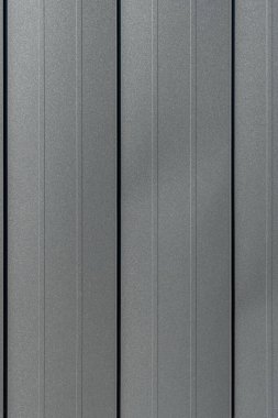 Texture of black metal standing seam facade. Minimalist building exterior design. Metal wall rebated panels as background clipart