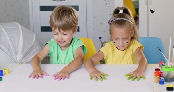 Siblings Try Leave Fingerprints Bright Gouache Paper Toddler Boy Preschooler — Stock video