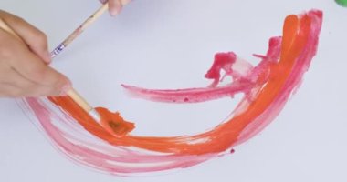 Kids try to paint amazing arc picture with watercolor paint and paintbrush on paper. Children put effort in painting and want to make gift for parents