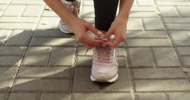 Sportswoman Ties Laces Shoes Jogging Park Illuminated Sunlight Young Woman — ストック動画