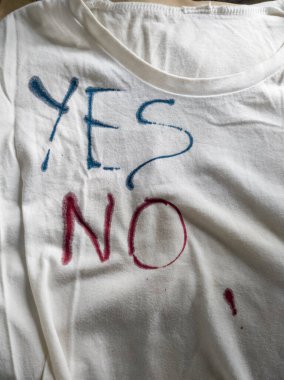 Writing Yes and No on T-Shirt with Ink