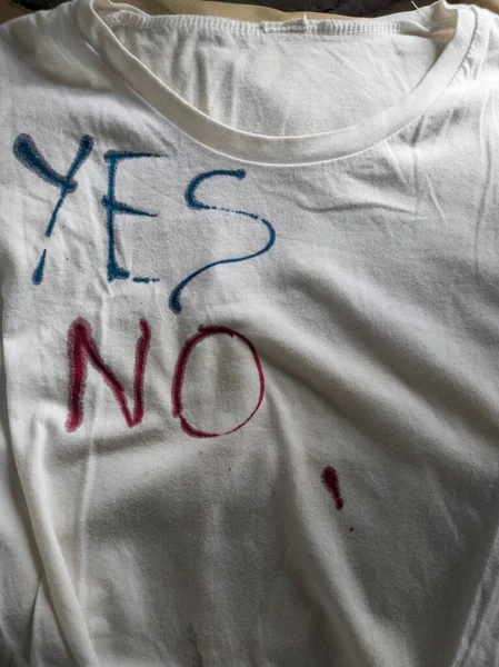 Writing Yes and No on T-Shirt with Ink