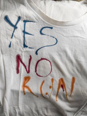 Writing Yes, No and Run on T-Shirt with Ink