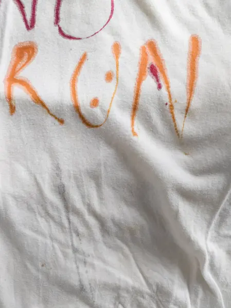 Writing Yes, No and Run on T-Shirt with Ink