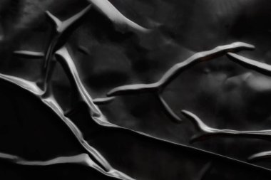 Siyah buruşmuş ve buruşmuş plastik poster dokusu arka planı