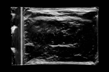 Blank transparent plastic bag overlay on black background