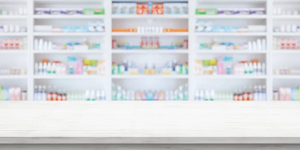 Stock image Empty white wood counter top with blur pharmacy drugstore shelves background