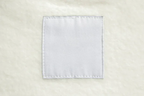 Blank White Laundry Care Clothes Label Fabric Texture Background — Stockfoto