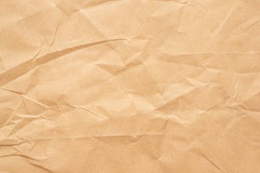 Abstract brown crumpled creased recycle paper texture background
