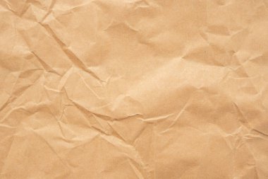 Abstract brown crumpled creased recycle paper texture background