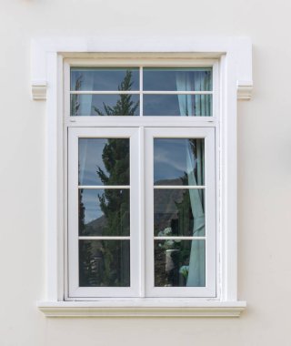 Vintage window frame outside the house