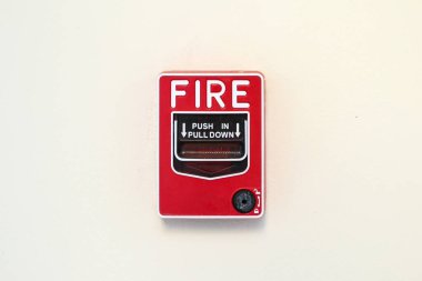 Fire alarm switch on white wall background