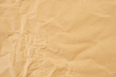 Abstract brown crumpled creased recycle paper texture background