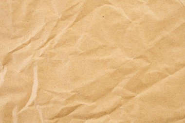 Abstract brown crumpled creased recycle paper texture background