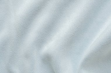 Yumuşak dalga arkaplanlı soyut mavi kumaş dokusu