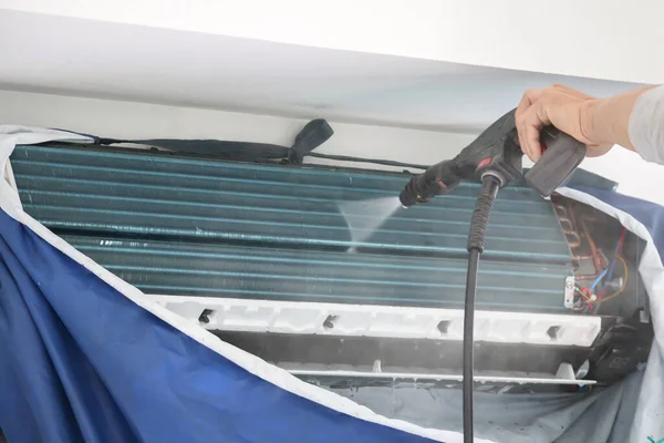 air conditioning cleaning service with water spray