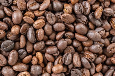 Fresh roasted brown coffee beans background