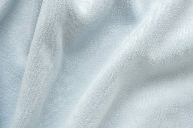 Yumuşak dalga arkaplanlı soyut mavi kumaş dokusu