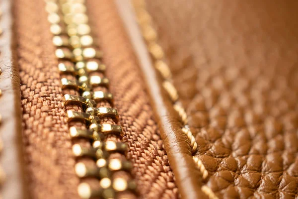 stock image close up of zipper on brown leather bag