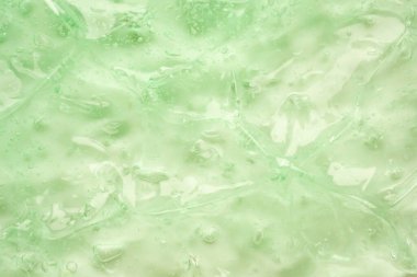 Şeffaf yeşil sıvı serum jel kozmetik doku arkaplanı