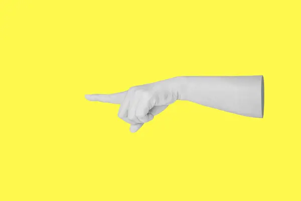 female hand touching or pointing to something isolated on yellow background