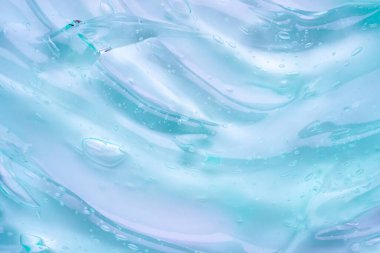 Şeffaf mavi sıvı serum jel kozmetik doku arkaplanı