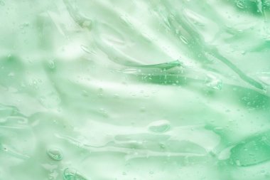 Şeffaf yeşil sıvı serum jel kozmetik doku arkaplanı