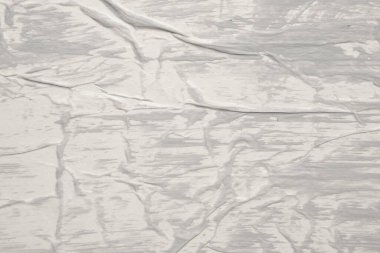 Beyaz buruşmuş ve buruşmuş kağıt poster arka planında gri renk