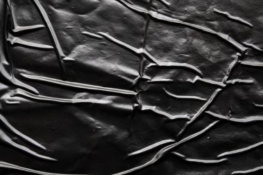Siyah buruşmuş ve buruşmuş plastik poster dokusu arka planı