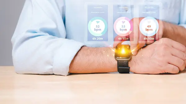 Using a health monitoring watch, a person employs cutting-edge technology to track and check their well-being, with vital health metrics displayed on the device\'s screen through a dedicated app.