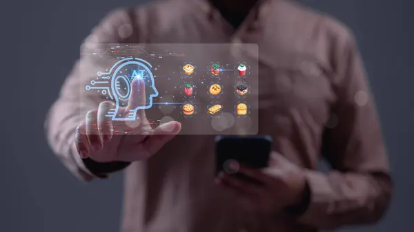 İşlemler, bir uygulama konseptiyle yiyecekler. Bir adam, Al olarak tanıtılan bir tablet ve yemek menüsü tutuyor. Menüde sandviç, kurabiye ve kek gibi şeyler yer alıyor.