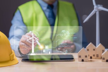 Sürdürülebilir Enerji Çözümleri 'ni geliştiren Profesyonel, rüzgar enerjisini ve sürdürülebilir konut gelişimini artırmak için şeffaf tablet ekranı kullanarak dijital enerji yönetimini araştırıyor